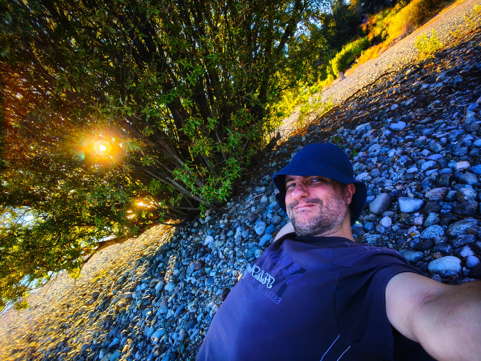Nelson E. Bolivar near the shore under a bright sky